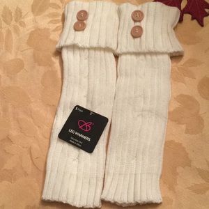 White knit leg warmers with button top.